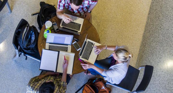 overhead view of students collaborating on school work